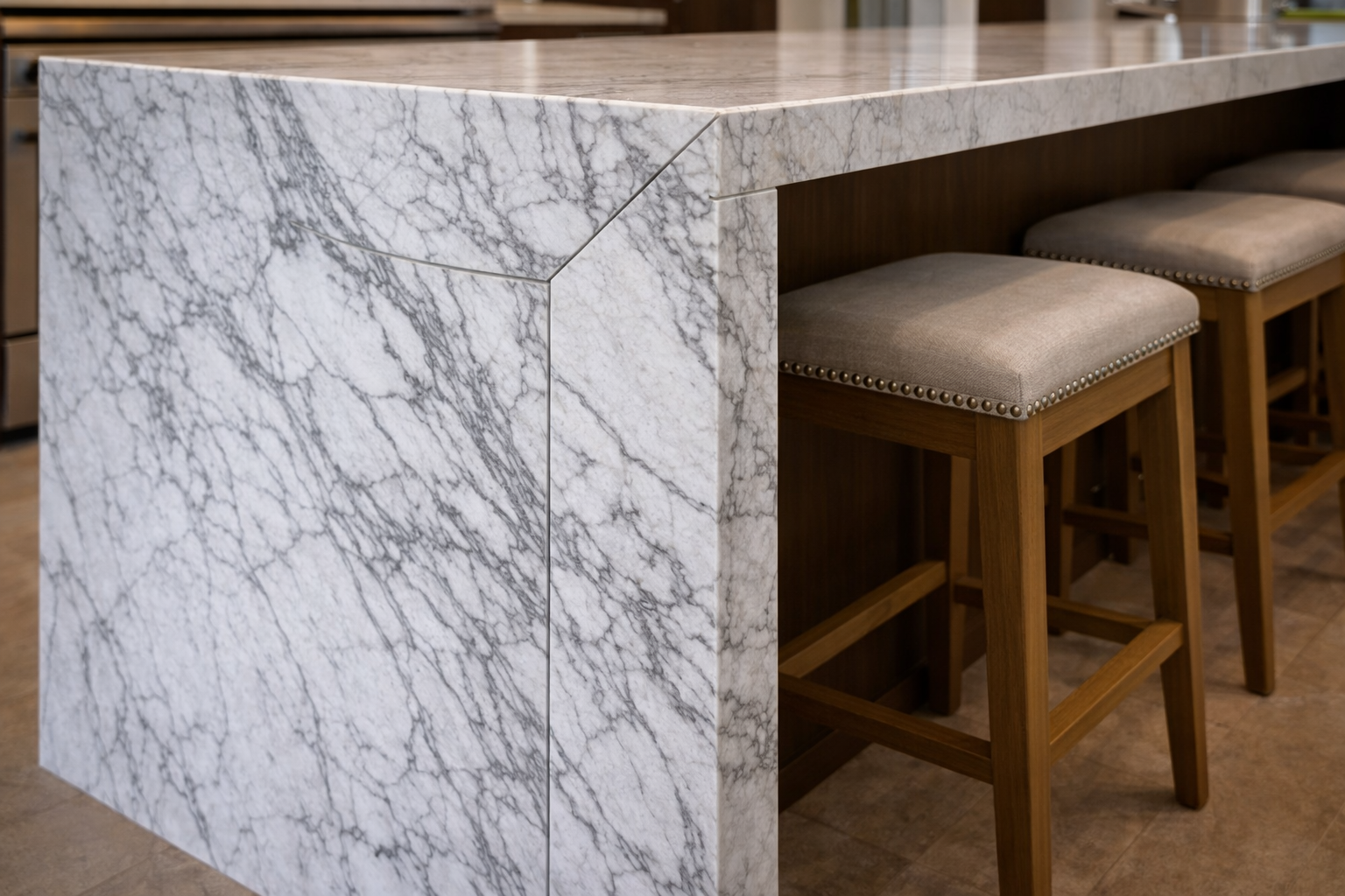 Waterfall island mistakes image showing poor seam planning oversized slab detail and layout conflicts with seating